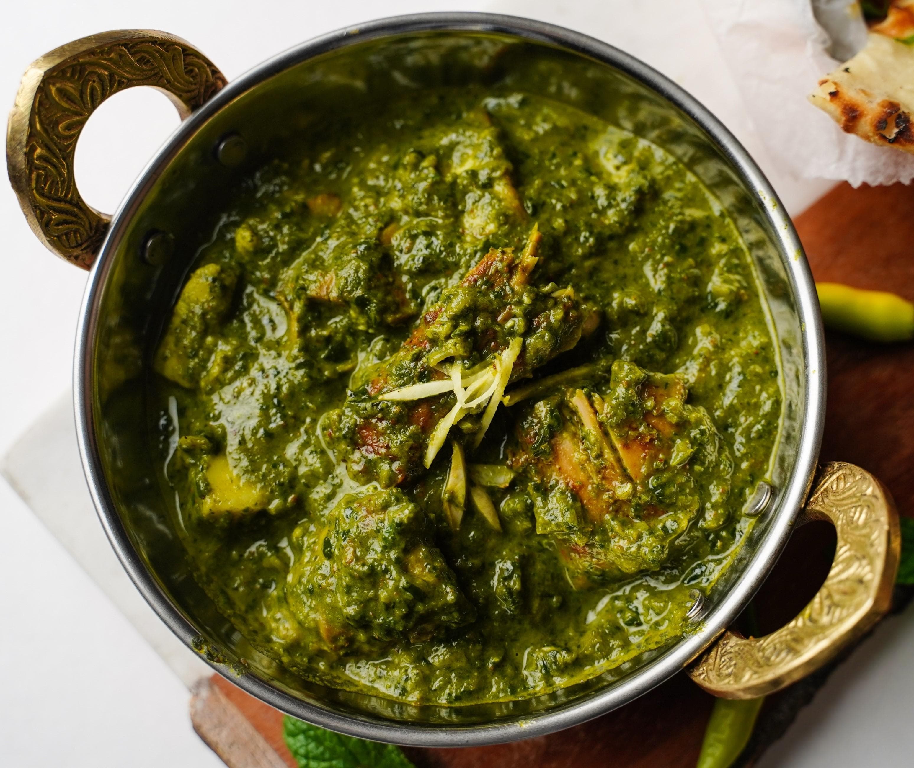Chicken Saag Masala, served at India Oven Sacramento